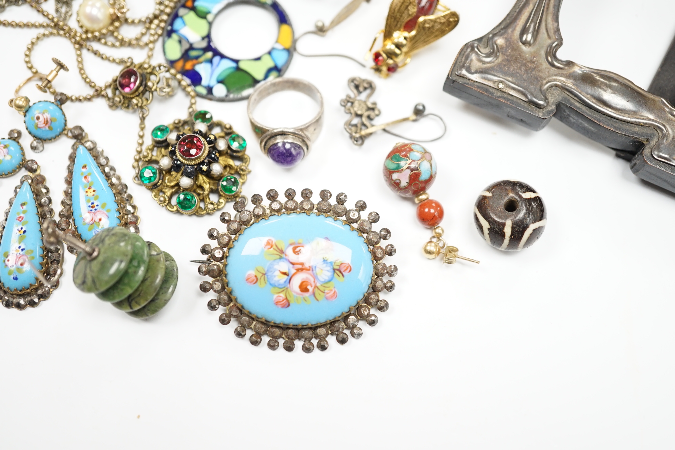 An Art Nouveau style sterling and enamelled double photograph frame, width 11.3cm, together with sundry jewellery including an Austro-Hungarian style necklace, white metal and cabochon amethyst set ring(stamped silver) e